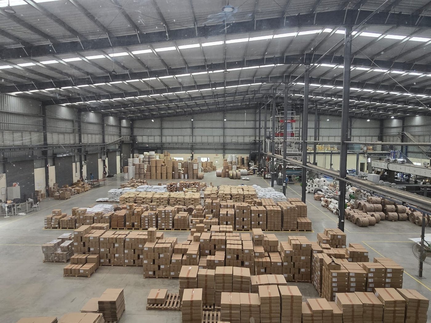 Bambrew's manufacturing warehouse in Bangalore, stacked with finished sustainable packaging ready to ship